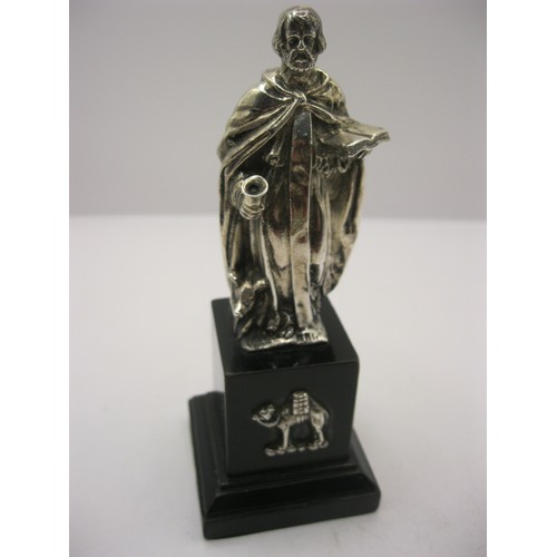 363 - A cast silver statue of St Anthony on wooden plinth with camel plaque representing his home of Egypt... 