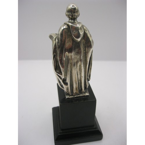 363 - A cast silver statue of St Anthony on wooden plinth with camel plaque representing his home of Egypt... 