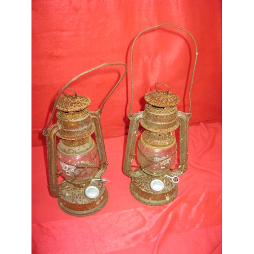 279 - A pair of vintage storm lanterns