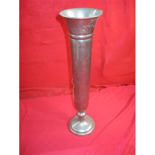 285 - A tall metal vase similar in design to the vases on 