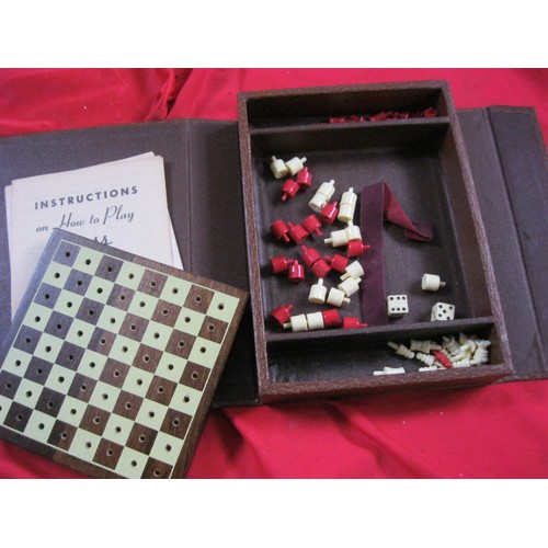 344 - A small cased travel chess, draughts and backgammon set in good order, appears complete, by Lowe