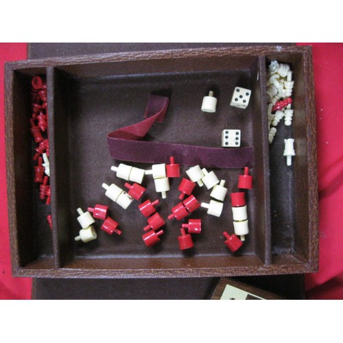 344 - A small cased travel chess, draughts and backgammon set in good order, appears complete, by Lowe