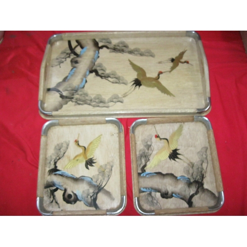 358 - A small set of laquered and painted Oriental nested trays