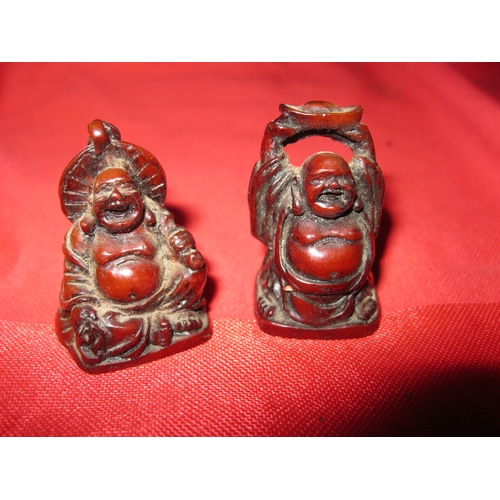 360 - A small pair of resin Buddha netsuki approx 1