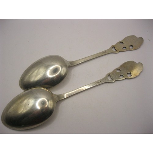 122 - A pair of Scandinavian 830 grade silver deco style serving spoons with squirrel finals