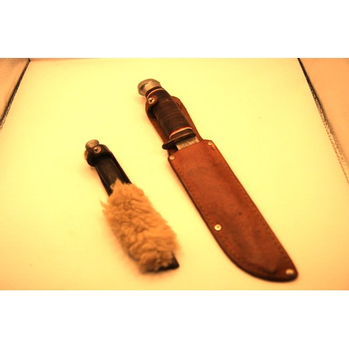 83 - A pair of sheath knives, the larger marked 'The Original Bowie Knife', the smaller a Scout knife by ... 