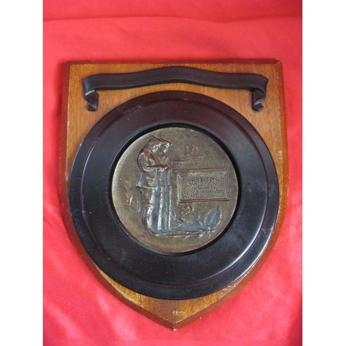 153 - A mounted military-style plaque