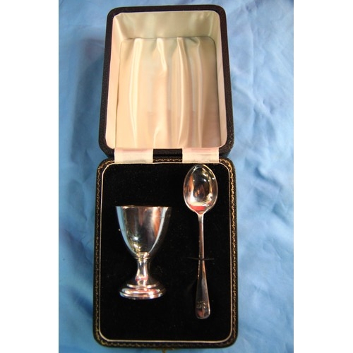 145 - A silver egg cup and spoon in a fitted case, hallmarks for London 1957, 53g approx weight