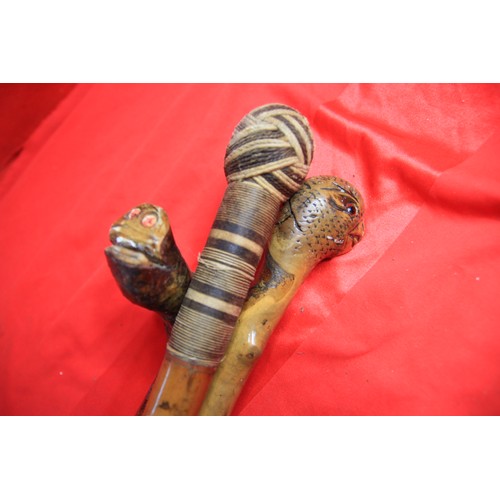 73 - Three ornately carved walking sticks