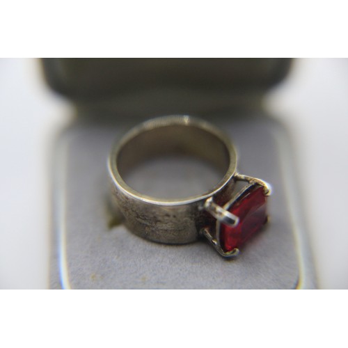 102 - A modern design sterling silver ring in size n set with a very large ruby which was formerly part of... 