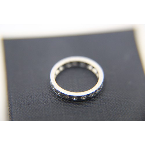 103 - A platinum eternity ring of good quality with bright stones in size L