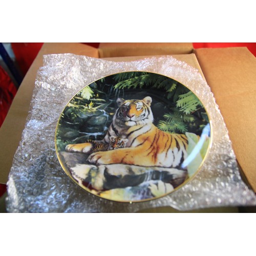 113 - Two boxes full of collectors plates mostly endangered species in original packaging .