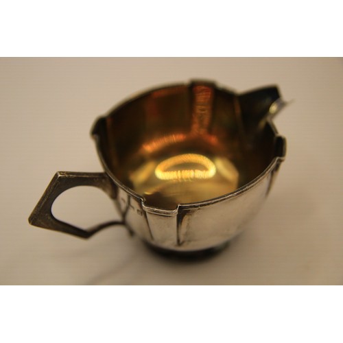 132 - An interesting art deco sterling silver creamer with gilt interior, hallmarked for Birmingham 1906 b... 