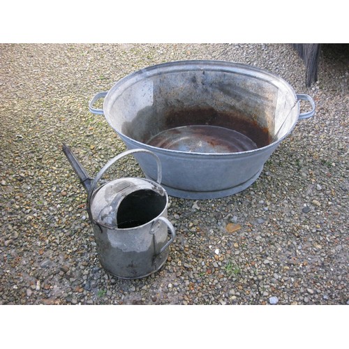 167 - A galvanised tub and a galvanised watering can, both hold water!