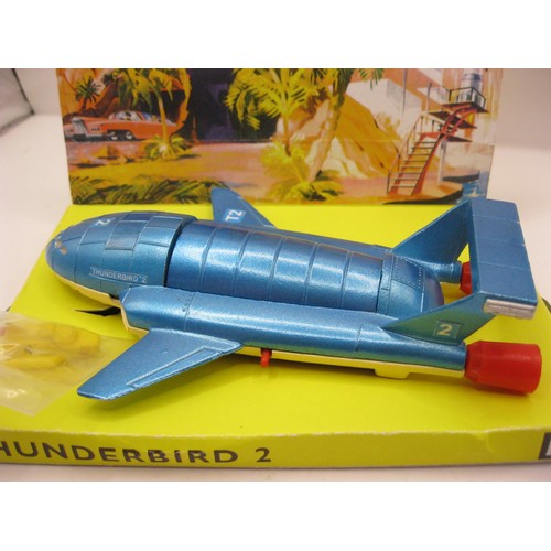 194 - A Dinky Toys #101 Thunderbird 2 & 4, boxed and in mint condition