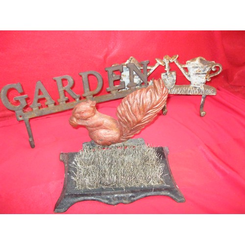 174 - A pair of cast iron, wall-mounting coat hooks and a cast iron boot scraper with a squirrel decoratio... 