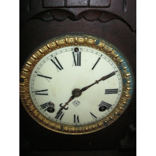 204 - An 8 day Tunis Strike Colonial style mantle clock by the Ansonia Clock Company