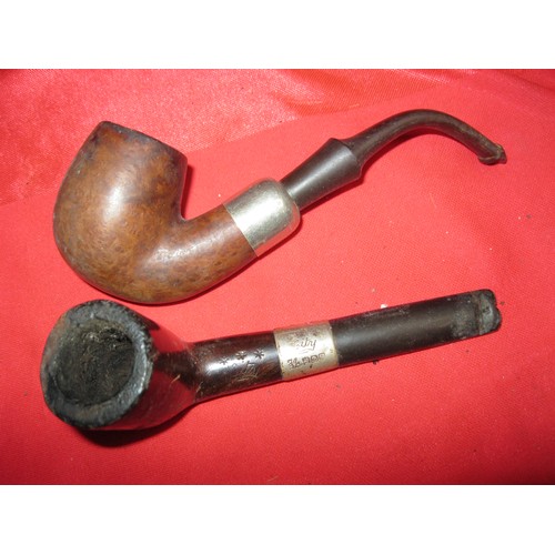 182 - A shoebox containing a selection of pipes including metal and wood versions (one a Peterson, one a s... 