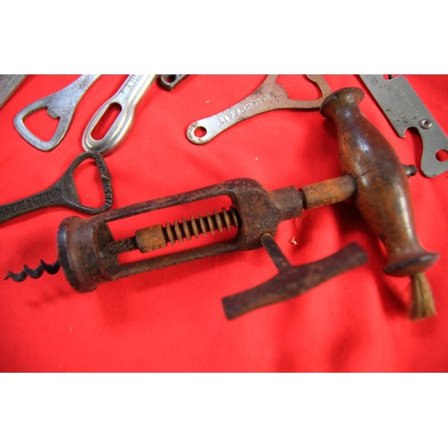 216 - An antique mechanical wooden-handled cockscrew with brush, plus a number of vintage and antique bott... 