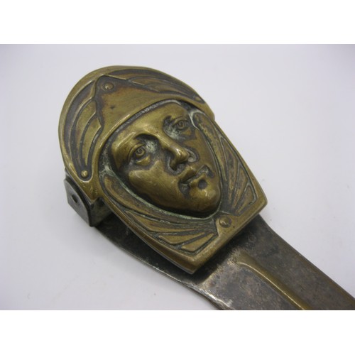 225 - A continental art nouveau silvered paperclip letter knife with female face decoration