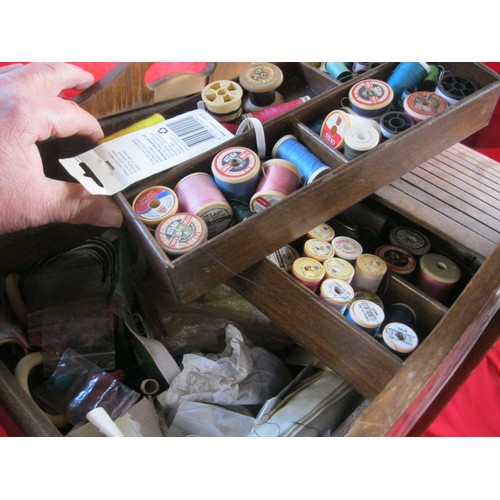 262 - A vintage floor standing sewing basket with roll top, includes contents