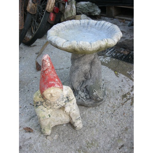 175 - A small stonecrete birdbath and a Portland Stone carved & painted garden gnome