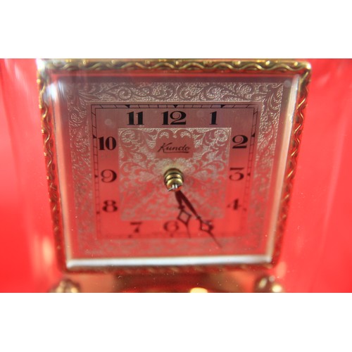 78 - A Kundo 400 day glass domed clock, boxed