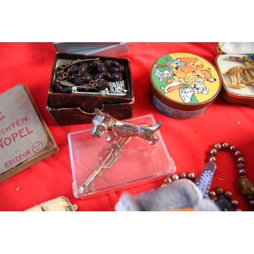 247 - A tin of interesting items including a Corgi Rockets 'The Saint' Volvo, a Mimic Jaguar Police slot c... 