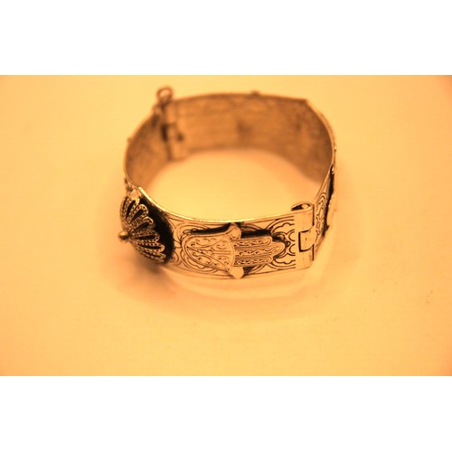 91 - A white metal bangle, likely of .800 grade Indian silver