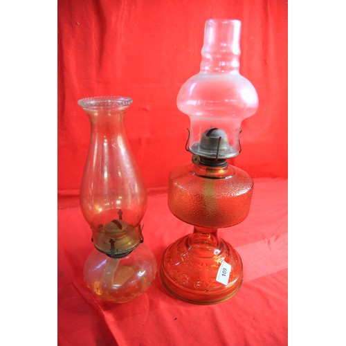 93 - Two oil lamps with glass bases both containing oil