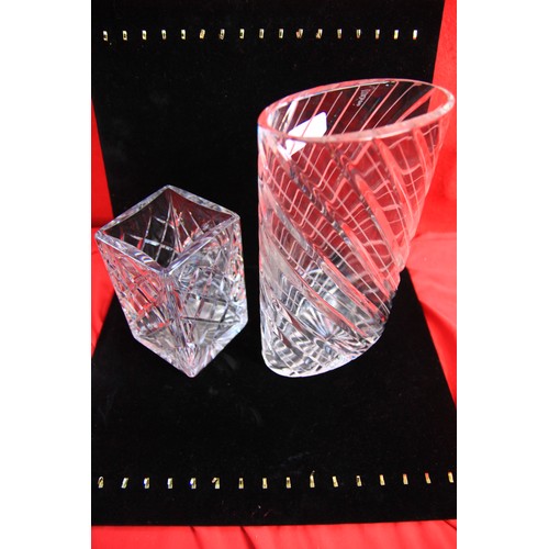 26 - Two cut glass vases one oval at ten inches tall and a square vase at six inches tall both in pristin... 