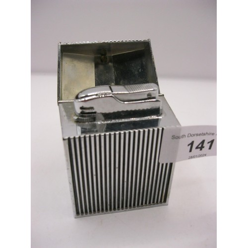 141 - A table cigarette lighter modelled as a Rolls Royce grille with Spirit of Ecstasy, chromium plate li... 