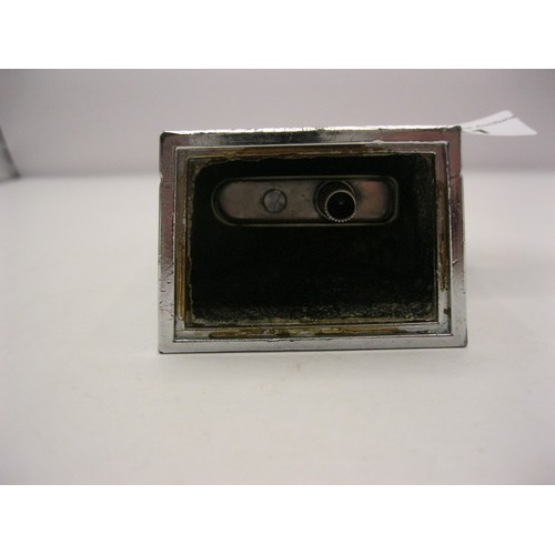 141 - A table cigarette lighter modelled as a Rolls Royce grille with Spirit of Ecstasy, chromium plate li... 