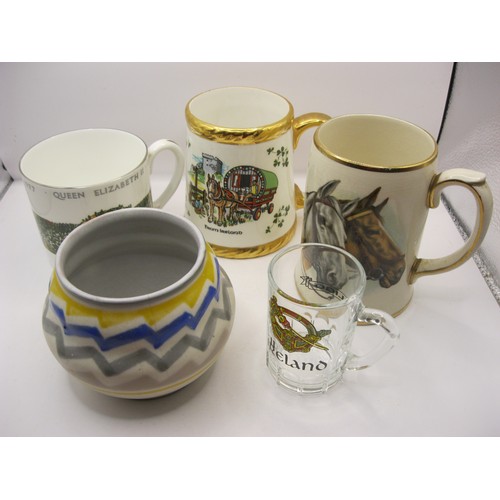 151 - A Poole pottery Jazzie pattern vase along with a selection of commemorative mugs Silver jubilee etc ... 