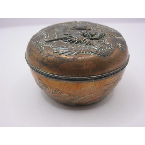 191 - A small but heavy Chinese copper pot, covered in copper, with ornate dragon chasing pearl design to ... 