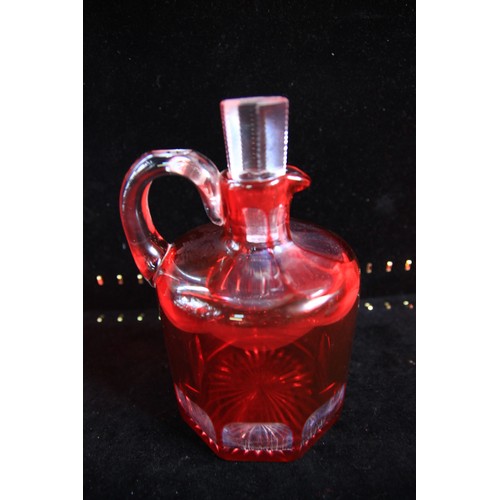 39 - Two Cranberry Glass Decanters standing a just over 7 inches tall in clean condition.