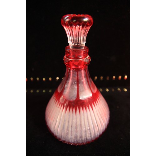 39 - Two Cranberry Glass Decanters standing a just over 7 inches tall in clean condition.