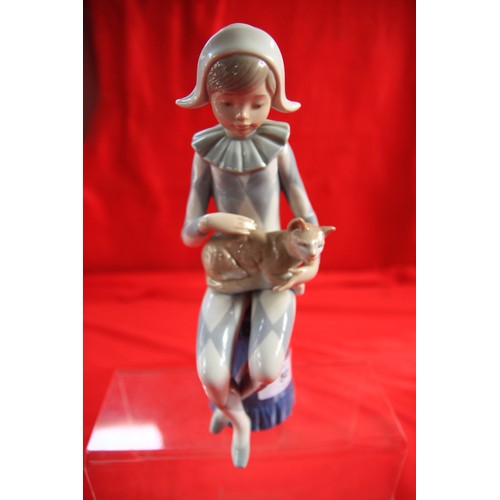 50 - Lladro Nao figurine of seated harlequin boy with cat, height 22.5cm