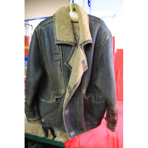 A 1970s leather flying jacket, worn but in good usable condition