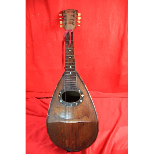 184 - Antique mandolin, veneered with mahogany and other woods, mother of pearl inlay. Five of the eight s... 