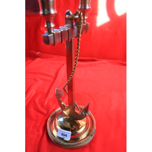 204 - A vintage silver plate candlestick holder in the form of a fouled anchor