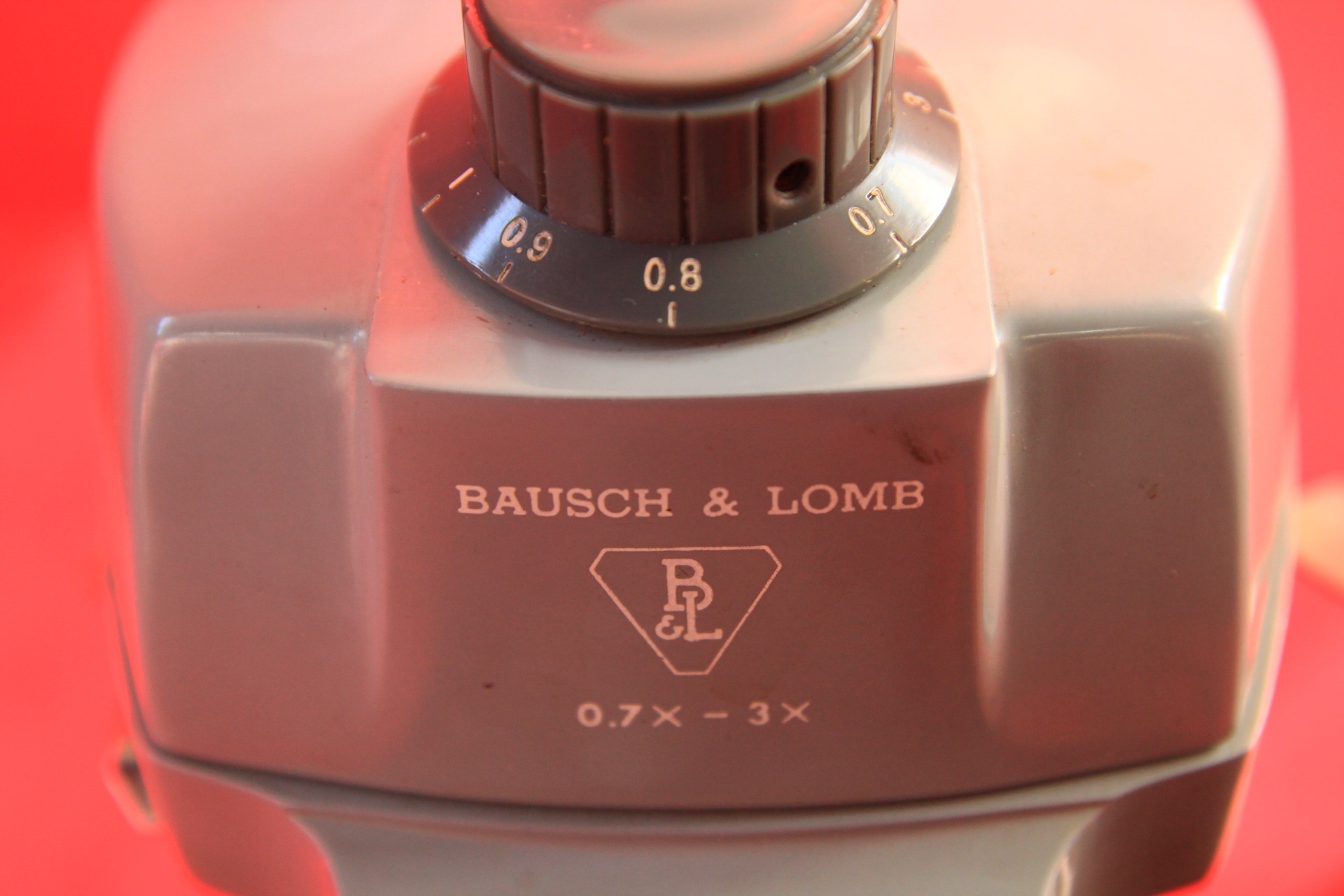 An Bausch and Lomb stereo microscope with power adapter and