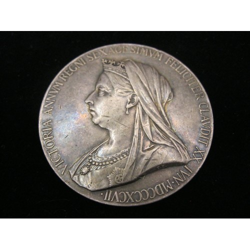 293 - A large (5.5cm diameter) sterling silver medallion issued to mark the diamond jubilee of HM Queen Vi... 