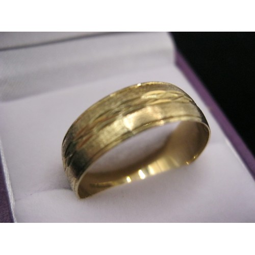 294 - A 9 carat gold wedding band, size W, approx weight 2.64g, attractive diamond cut design and quite su... 