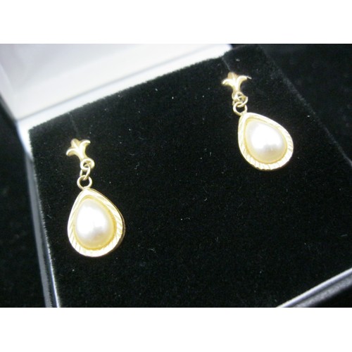 300 - A pair of 9 carat gold pearl drop earrings