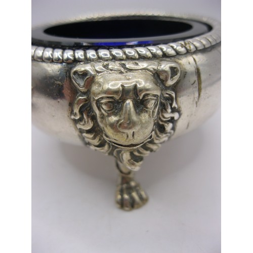 247 - A pair of George II silver salts with cobalt blue glass inserts, with lions mask feet and fluted rim... 