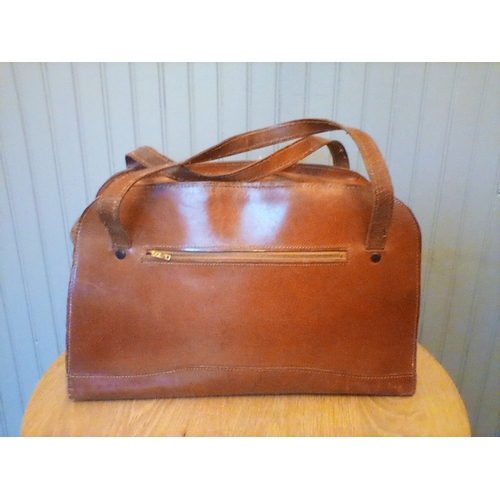 310 - A large vintage Italian leather bag with hand-tooled decorative relief front panel in good condition... 