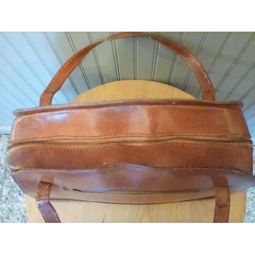 310 - A large vintage Italian leather bag with hand-tooled decorative relief front panel in good condition... 