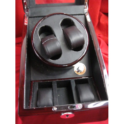 27 - An automatic watch winder by C. W. Sellors Jura,