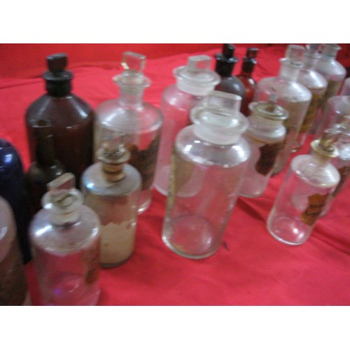 56 - A crate of Apothecary Bottles, many of blown and not moulded glass with etched stoppers